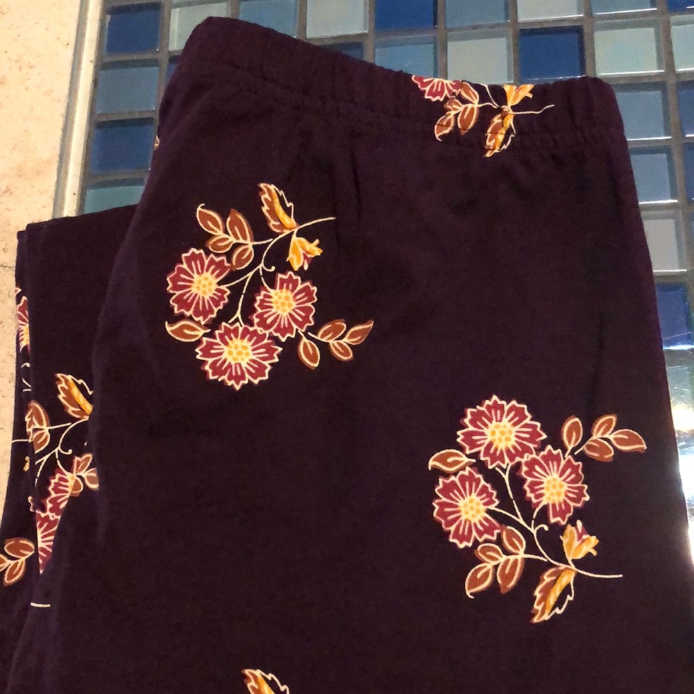 Old Navy dark purple leggings with yellow and orange flowers